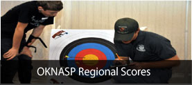 image:kid looking over shoulder of Department employee scoring the target
