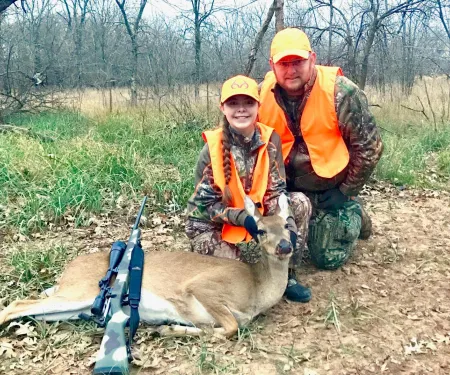Natalee and Larry Heck with harvested deer.