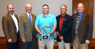 Gathered for the 2020 Fisheries Professional of the Year presentation are, from left, ODWC Director J.D. Strong, Fisheries Chief Barry Bolton, Durant Hatchery Assistant Manager Shane Lewis, ODWC Assistant Director Wade Free, and Fisheries Assistant Chief Ken Cunningham. (Don P. Brown/ODWC)