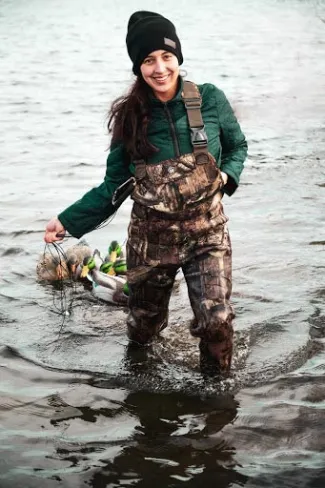 Girl in water with duck decoys.  Photo by Sarah Southerland