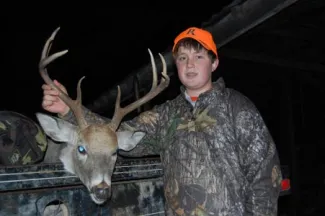 Youth boy with buck.
