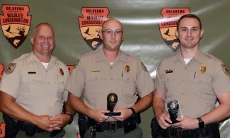 Law Enforcement Chief Col. Nathan Erdman with Game Wardens Austin Jackson and Riley Willman, recipients of the Colonel’s Life Saving Citation.
