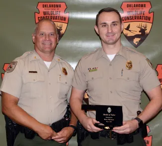 Chief of Law Enforcement Col. Nathan Erdman with Game Warden Riley Willman, recipient of the Medal of Valor.