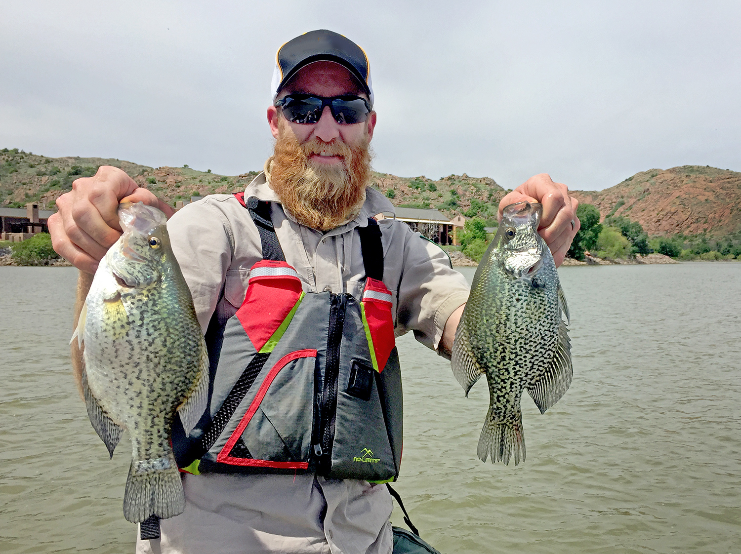Fisheries technician John Perry holds several crappie that turned up during recent fish sampling surveys at Lake Altus-Lugert in southwestern Oklahoma. Biologists report that the lake is again a viable fishery after toxic golden algae blooms in 2012 and in 2014.