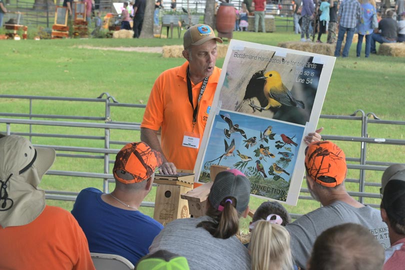 Fish biologist helping teach bird identification at Wildlife EXPO.