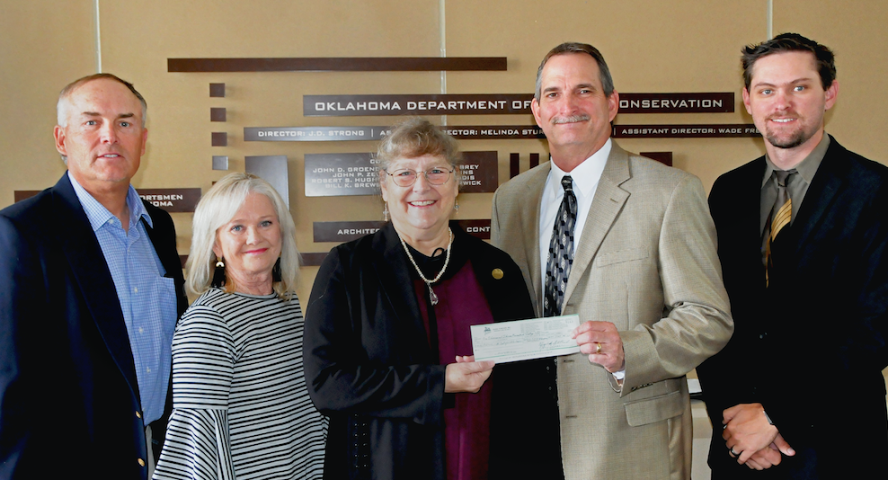 Gathered for a donation to the Stars and Stripes License Project are, from left, Assistant Director Wade Free, Assistant Director Melinda Streich, Laura McIver of Quail Forever, Wildlife Assistant Chief Bill Dinkines and Upland Game Biologist Tell Judkins. (Don P. Brown/ODWC)