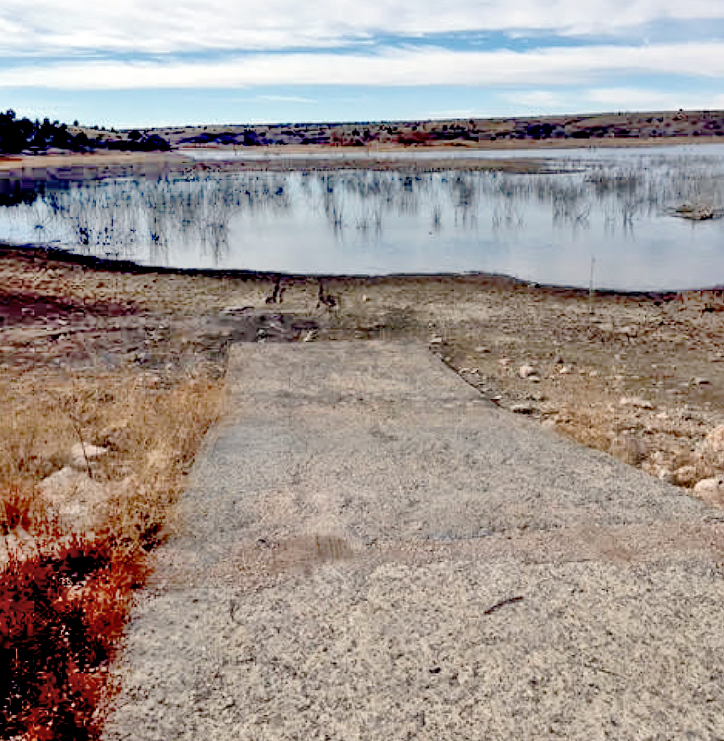 The exposed boat ramp at Lake Carl Etling in Cimarron County demonstrates how low the water level is at the Wildlife Department fishing lake. (Photo: Chas Patterson/ODWC)