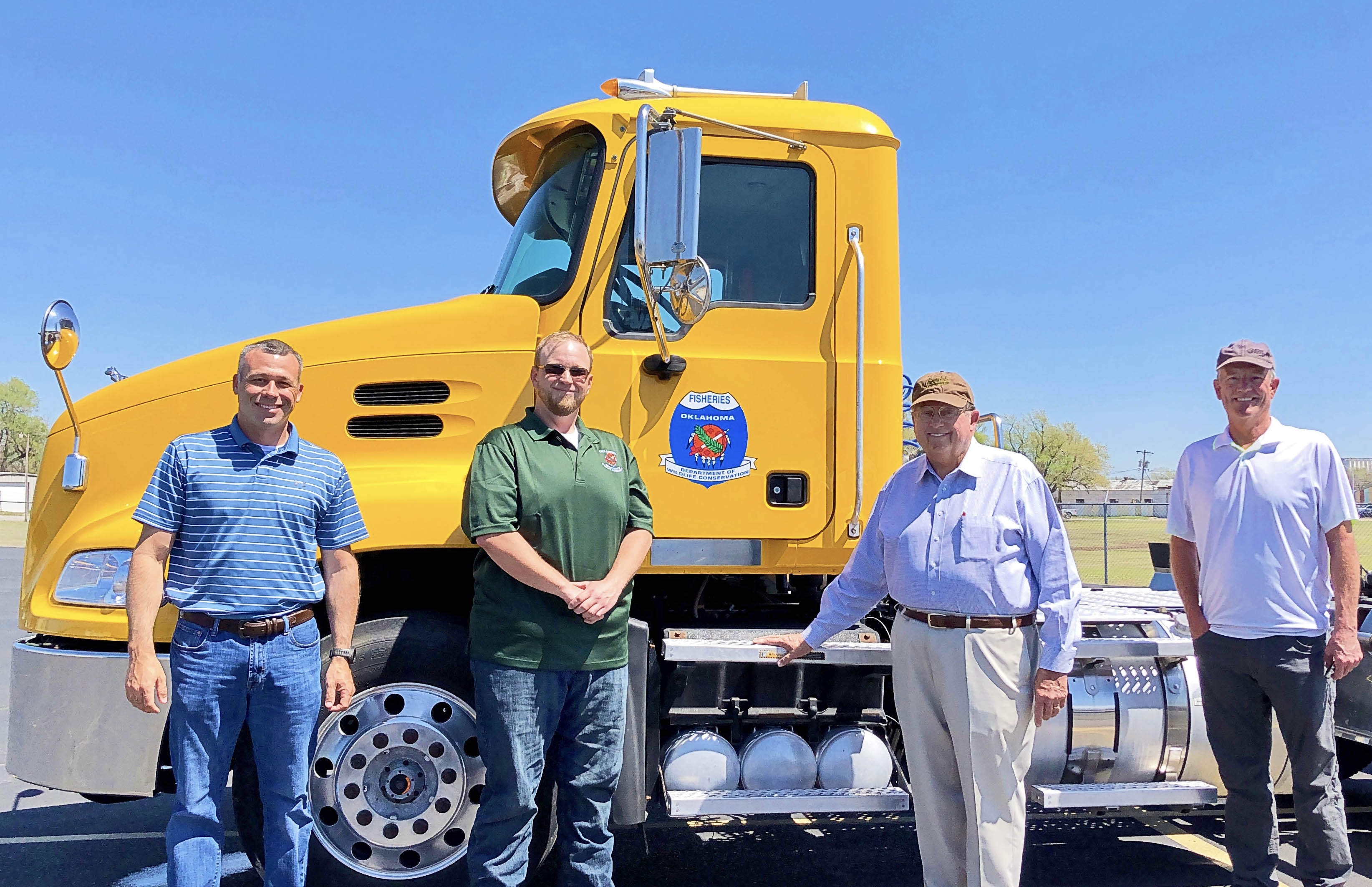 Groendyke Transport Inc. of Enid donated a 2013 Mack Trucks semi-tractor to the Wildlife Department's Fisheries Division. Gathered for the presentation are, from left, Chas Patterson, Northwest Region Fisheries Supervisor; Colby Rowe, heavy equipment operator; John D. Groendyke, CEO of Groendyke Transport Inc.; and Barry Bolton, Fisheries Chief. (ODWC Photo)