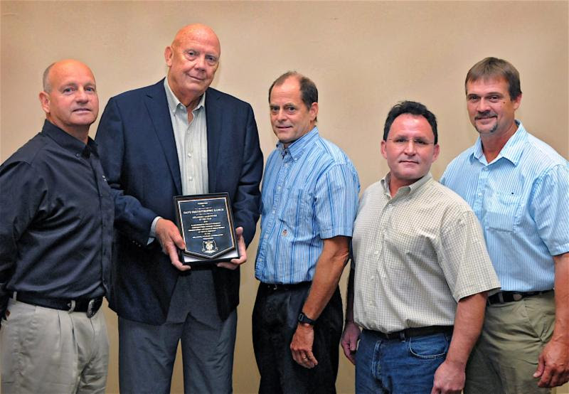 Gathered for the 2016 Landowner of the Year Award presentation are, from left, Alva Gregory, habitat coordinator for the Wildlife Department; Dave Smith, owner of Trophy Ranch; and associates Bob Thomas, Steve Trygstad and Audey Clark.