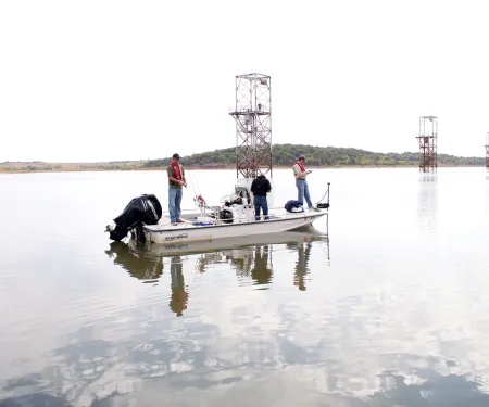 People on a boat fishing Kaw Lake