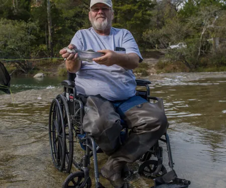Man in wheelchair at Blue River.