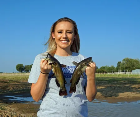 Girl holding bullhead catfish. Photo by Brandon Brown/ODWC