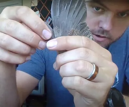 Upland Game Biologist Tell Judkins takes a measurement of a donated quail wing. Click on the photo to see a video about how these wings provide data that can assist with quail management.