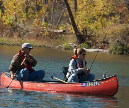 Man and woman in canoe.