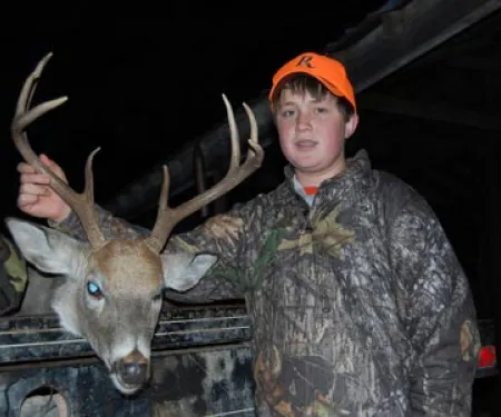 Youth boy with buck.