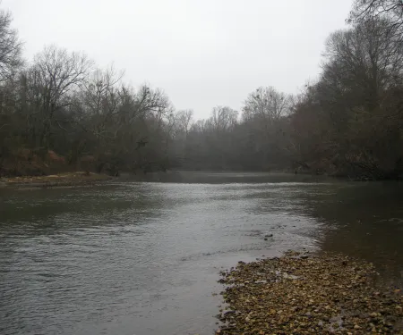 A landscape view of the Little River taken after the leaves have dropped from the trees