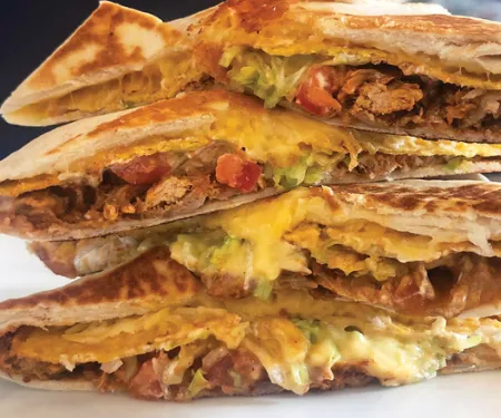 A photo of a stack of crunch wrap.