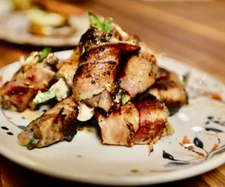 Bacon wrapped dove with figs, plated and ready to serve. Yum!