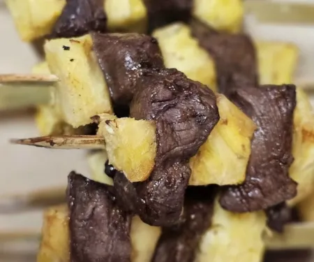Plated air fryer teriyaki venison pineapple kabobs