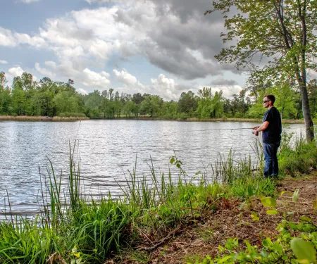 Angler fishing on bank at Lake Schooler in Choctaw County