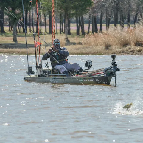 Man fishing from kayak.