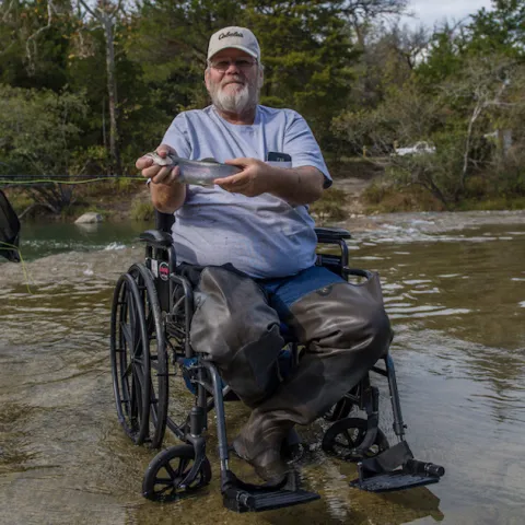 Man in wheelchair at Blue River.