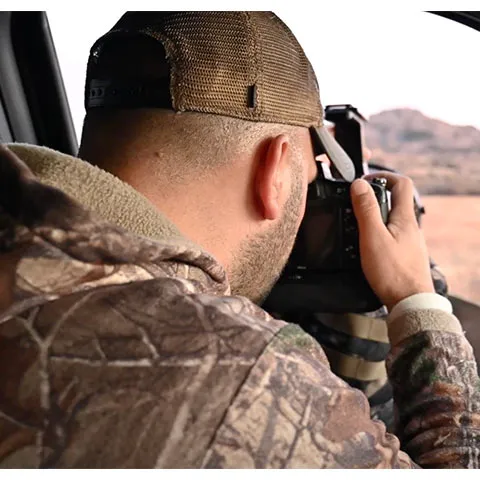 Jeremiah Zurenda combines skills of hunting and photography, shooting a camera out the window.