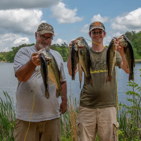 Anglers with largemouth bass.