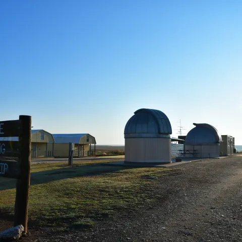 A series of structures with a sign for the Selman Living Lab in northwestern Oklahoma. 