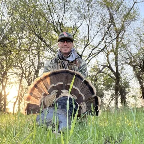 Ryan Talley with his harvested Oklahoma turkey.