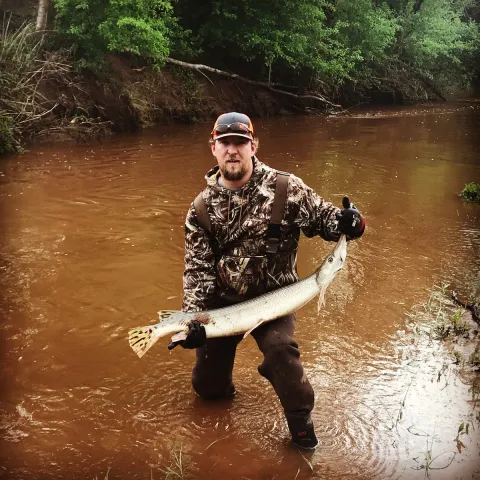 Kaleb Williams holding a Longnose Gar