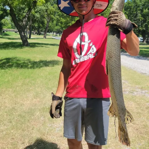 Nathan G holding a Longnose Gar