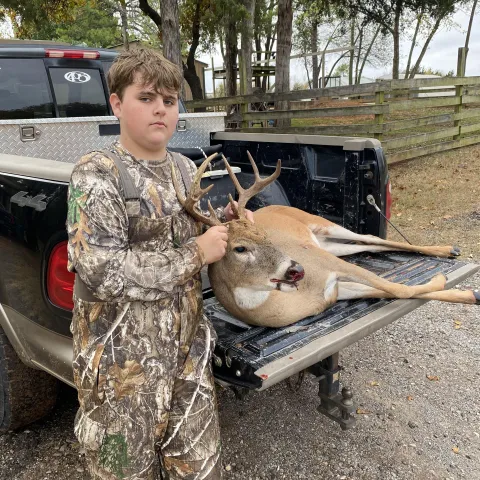 young man with buck