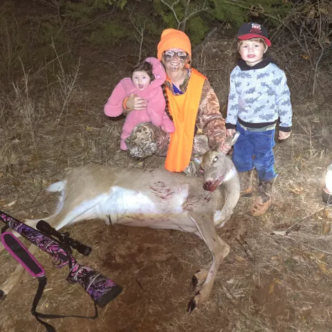 mom with kids and buck