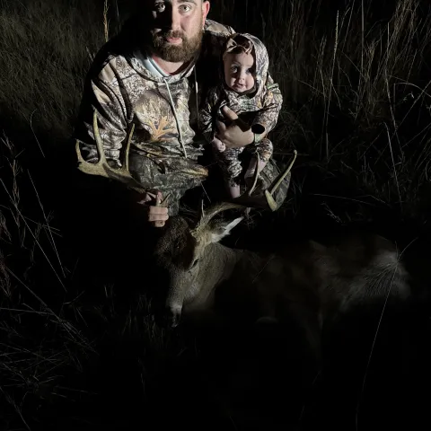 man and child with buck