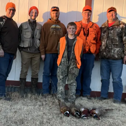 group of men with pheasant