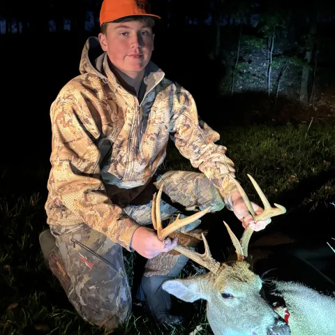 Parker Adams with his harvested Oklahoma whitetail deer.