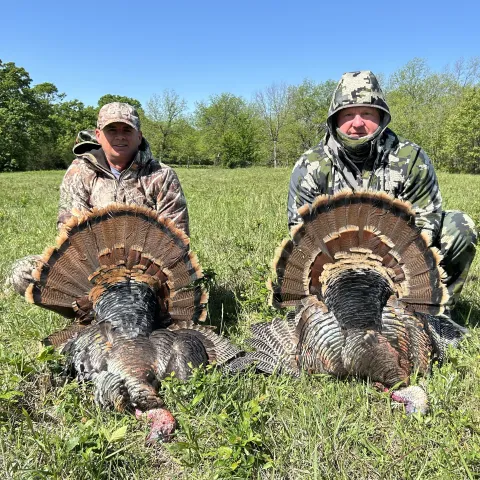 Bryan Page and Adam Horton with their harvested Oklahoma Wild Turkeys