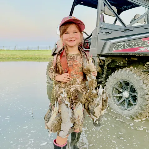 Trey Hutchison and his daughter with their harvested Oklahoma Dove.
