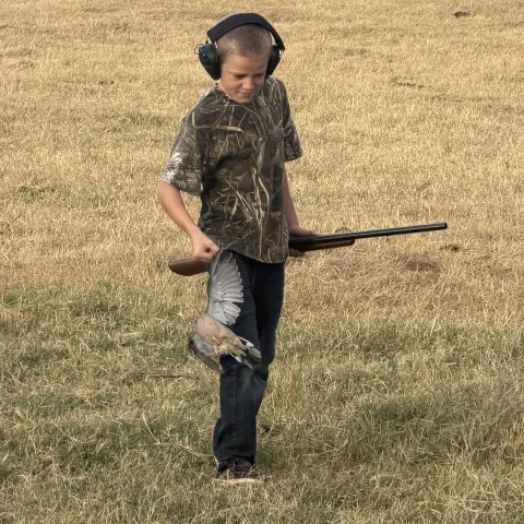 Braxton with his first harvested Oklahoma Dove.