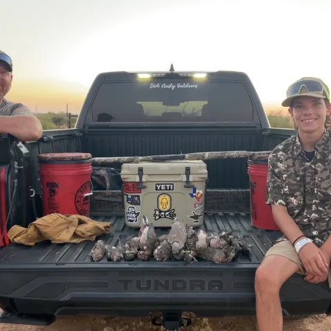 Chris and his son Brian with their harvested Oklahoma Dove.