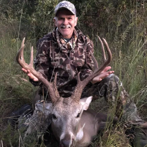 Hunter pictured with harvested deer.