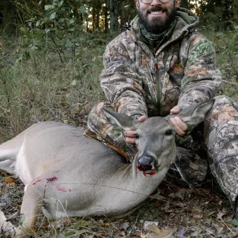 Hunter pictured with harvested deer.