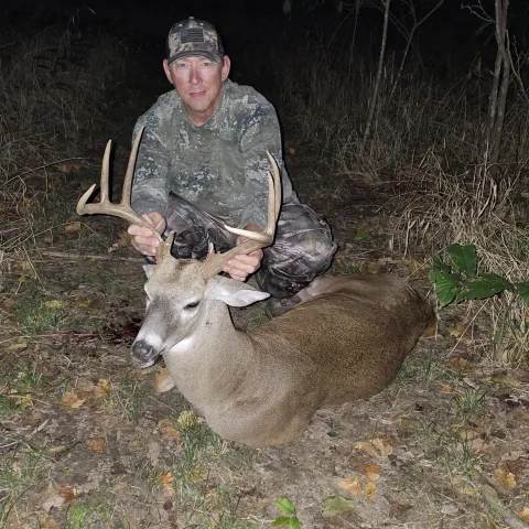 Man with harvestd buck