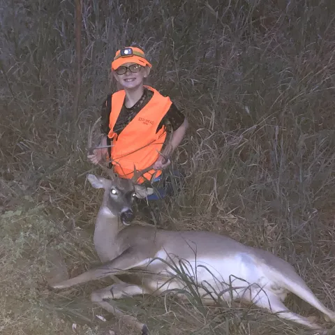 young girl with  harvested buck