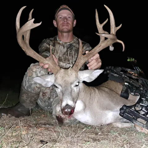 Male with archery buck