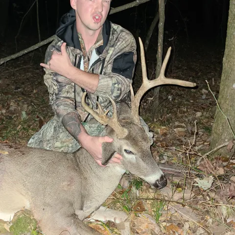 Man with harvestd buck