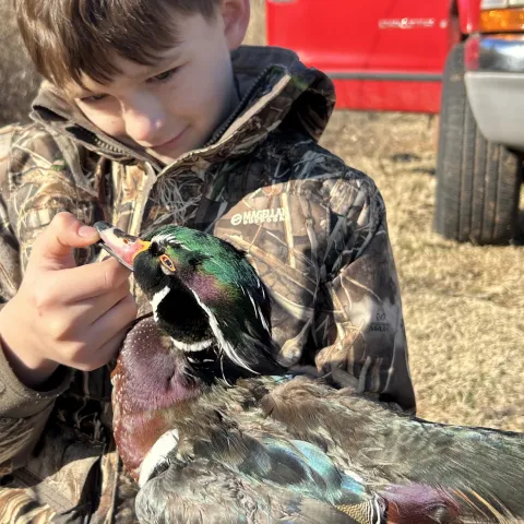 Young waterfowl hunter with Mallard drake 
