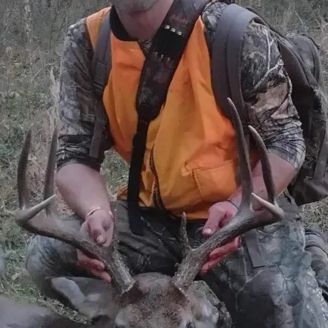 Hunter pictured with harvested deer.