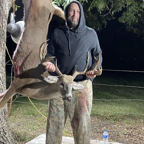 Hunter pictured with harvested deer.
